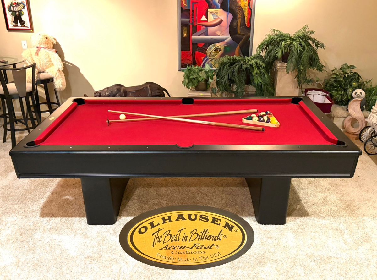 OLHAUSEN red felt billiards pool table with accu-fast cushions. Comes with balls, cues, cue stand, table cover, chalk, triangle, etc. 100“(L) x 56“(W) x 30.5“(H)  