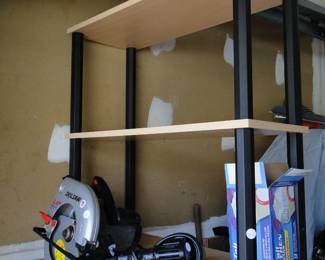 Skilsaw, drill and bookshelves