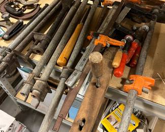 Many woodworking pipe clamps and bar clamps.
