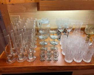 Set of 18 Pilsner beer glasses (left in photo); set of eight smoke champagne or tall sherbet glasses; 