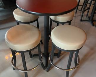 Five high top tables, 10 bar stools, and six bar chairs/stools by MTS Seating (chairs) and Custer (tables).