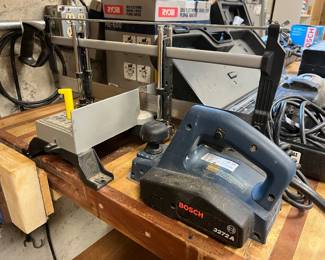 Stanley mitre saw; Bosch electric hand-held wood planer.
