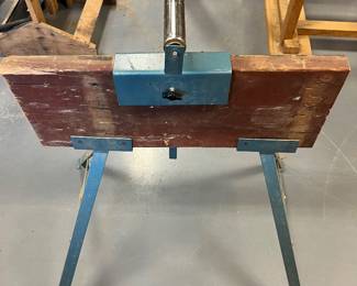 Portable material roller stand.