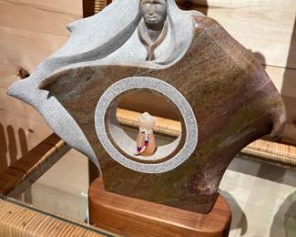 Sculpture signed “Menlg ‘92”.