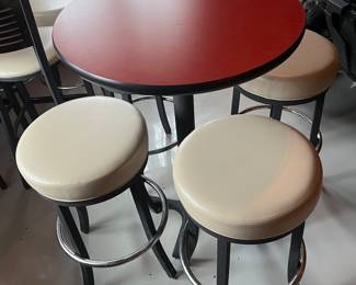 Five high top tables, 10 bar stools, and six bar chairs/stools by MTS Seating (chairs) and Custer (tables).
