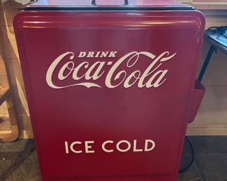 Refrigerated Coca-Cola cooler.