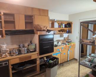 kitchen appliances, pots, pans, silverware, cups, plates, dishes