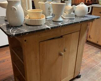 Marble top cabinet on casters