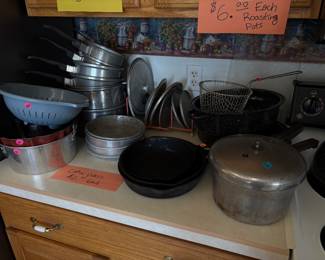 Aluminum pots and pans, cast iron skillets, cake pans