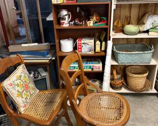 Old cane chair and cane chair needing repair, steins, riding helmet