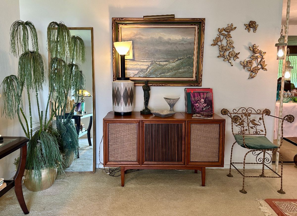 The console and gold chair are sold.