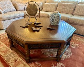 The butterflies and blue and white urn on the table are sold.