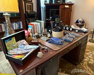 Desk, office supplies, Mason books, hats