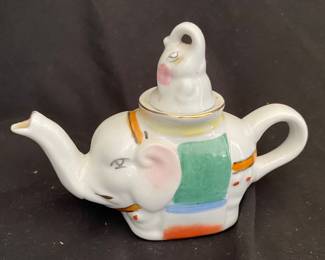 a vintage Chinese porcelain elephant-shaped teapot