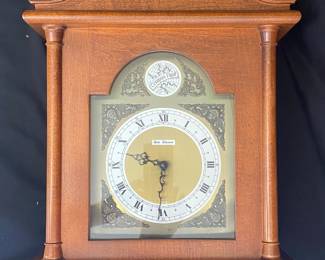 a vintage Seth Thomas wall clock featuring a wooden case and a "Tempus Fugit" (Latin for "time flies") inscription on the dial. 
