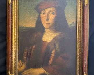 a framed vintage reproduction print of the Renaissance artwork Portrait of a Young Man with an Apple by Raphael