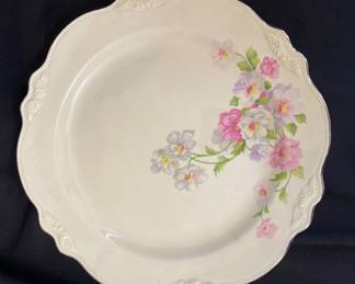 a vintage Homer Laughlin dinner plate in the "Virginia Rose" shape featuring the "Fluffy Rose" floral decal and a platinum trim