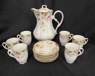 an antique Nippon hand-painted floral chocolate set, which includes a chocolate pot and matching cups and saucers