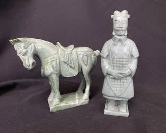 collectible Chinese carvings, specifically a Tang dynasty style jade horse and a Terracotta warrior figure