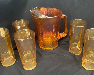 a Jeanette Glass Iridescent Marigold Honeycomb Pitcher and Tumbler set