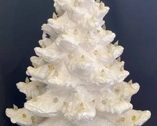 a vintage-style glazed ceramic Christmas tree, often referred to as a "snow-tipped" or "pearl white" ceramic tree