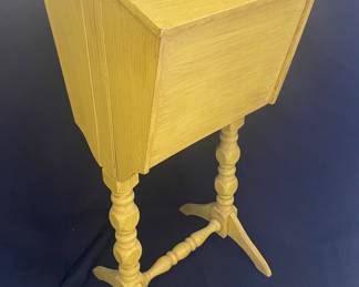 a vintage Priscilla-style sewing box stand, likely dating from the 1930s to 1950s, featuring a painted wooden finish