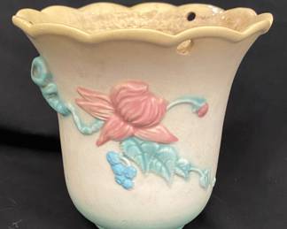 a vintage Hull Art Pottery hanging jardiniere or planter from the Woodland line, likely produced between 1949 and 1950