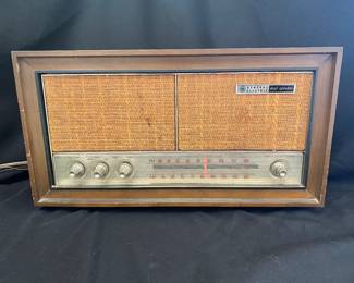 a vintage General Electric T1243B AM/FM dual-speaker tube radio