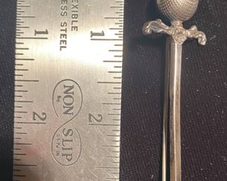 a vintage Scottish sword brooch, specifically a claymore-style kilt pin typically made of sterling silver. It features a large, faceted citrine or amber-colored rhinestone set into the pommel by Robert Allison