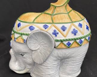 a vintage Arnel's ceramic elephant figurine featuring a hand-painted, colorful decorative saddle