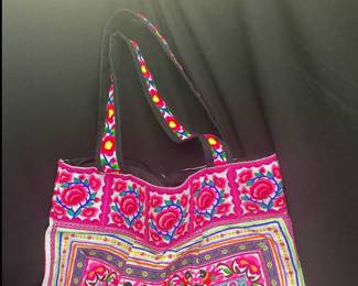 a colorful Hmong Hill Tribe Embroidered Tote Bag, often handcrafted in Thailand and featuring intricate florals