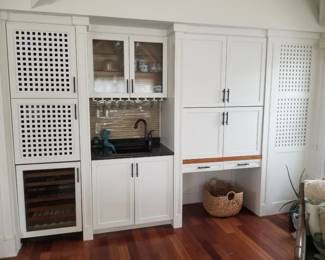 Wet bar with wine cooler; wheelchair accessible desk