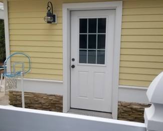 Entry door; exterior light fixtures