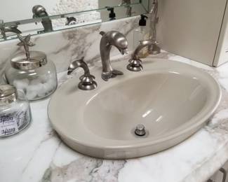Double bath vanity sinks feature dolphin hardware
