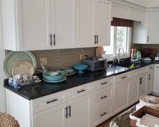 Crisp white cabinetry by Quality Custom Cabinetry