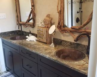 Double bath vanity by Quality Custom Cabinetry with unique sinks