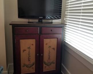 Two-drawer cupboard; flat screen TV