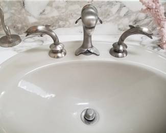 Double bath vanity sinks feature dolphin hardware
