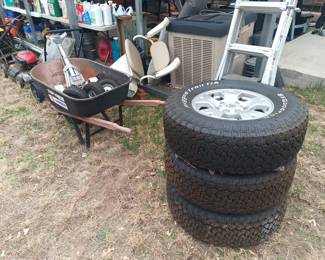 Tires and ladders and wheelbarrow 