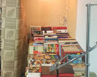 Reading material and rolled rug.   Body not included