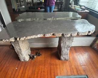 Polished quartz table on stone base