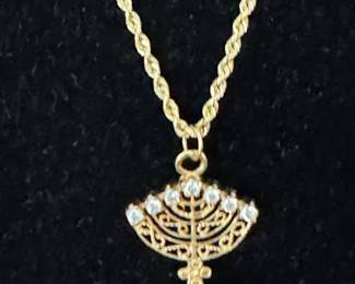 #110 - $400 - 10kt gold rope chain 18"and minora pendant with diamonds on one side/ rubis on other 