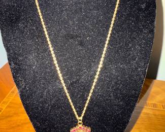 #110 - $400 - 10kt gold rope chain 18"and minora pendant with diamonds on one side/ rubis on other 