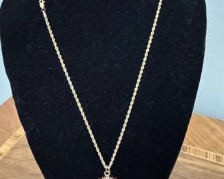 #110 - $400 - 10kt gold rope chain 18"and minora pendant with diamonds on one side/ rubis on other 