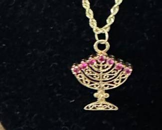 #110 - $400 - 10kt gold rope chain 18"and minora pendant with diamonds on one side/ rubis on other 