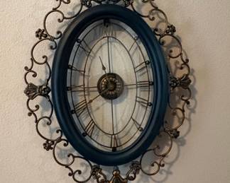 Ornate Oval Wall Clock with Roman Numerals
