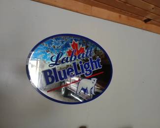 Lots of beer signs and early signs in garage