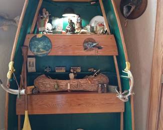 Cool old boat, husband made into shelf. Birch bark canoe, folkart paddle,duck decoys, sportsman button, fishing lures and reals. More not pictured