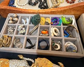 Vintage costume earrings collection in jewelry tray