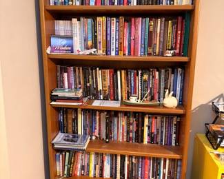 Wooden bookcase with extensive book collection
